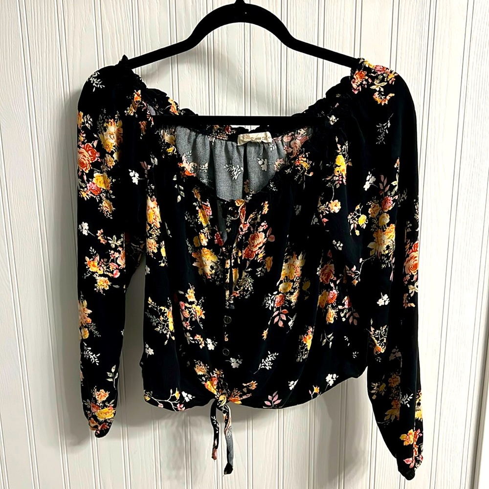 Cute top! Two string ties in front with line of buttons. Size medium.